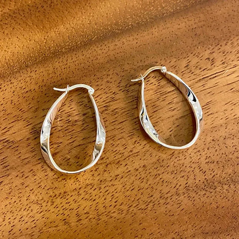 VAIGE Modern Silver Twist Hoop Earrings in Irregular Geometric Design